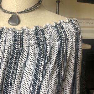 Off the shoulder black and white top.